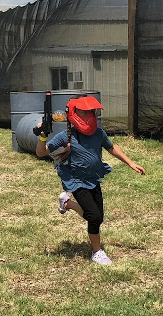 Gellyball player running with blaster