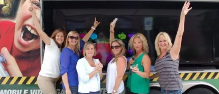 Adults celebrating at a game truck party